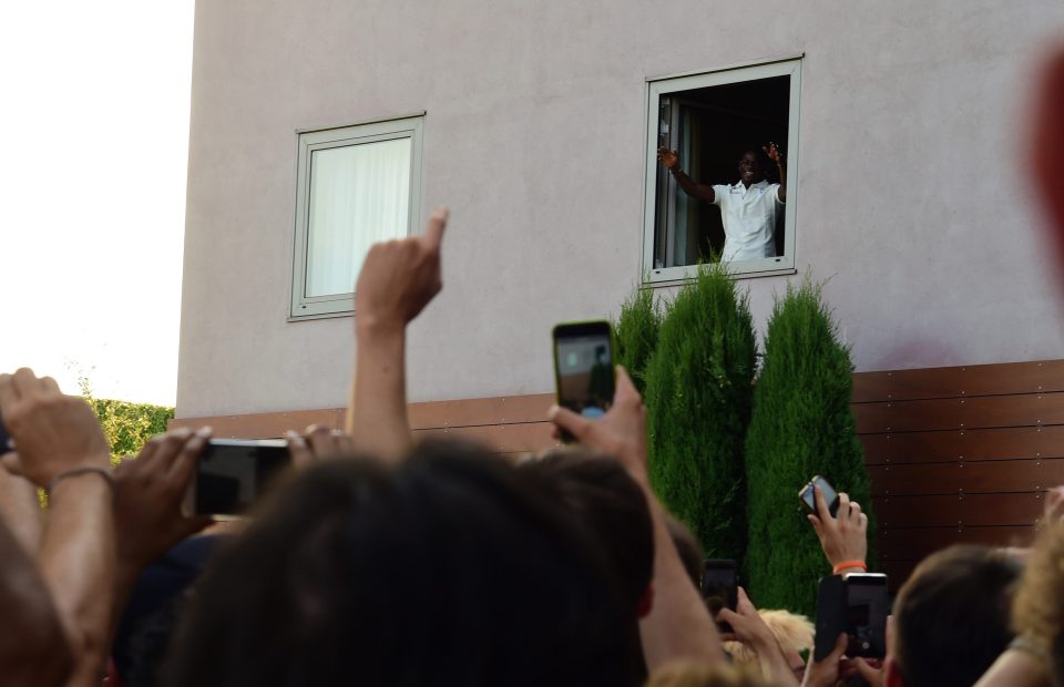  Mario Balotelli is lauded by fans outside a local hotel before Brescia unveiling