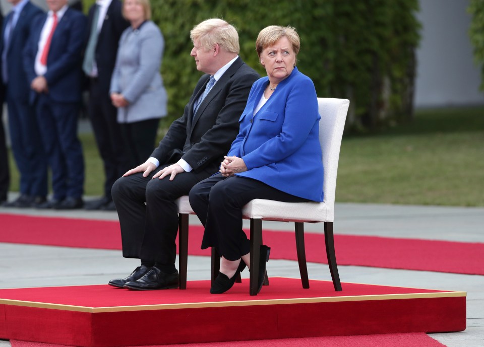  Boris and Angela Merkel listened to their national anthems together before a press conference and dinner