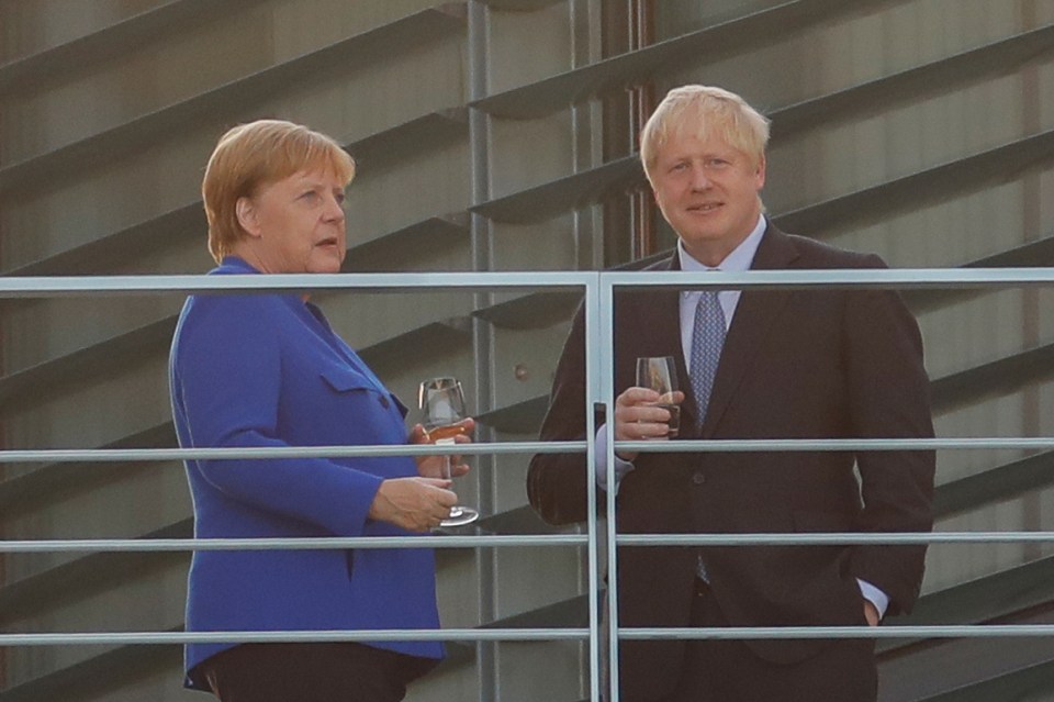  The pair chatted over a drink - Mrs Merkel appeared to opt for a glass of wine