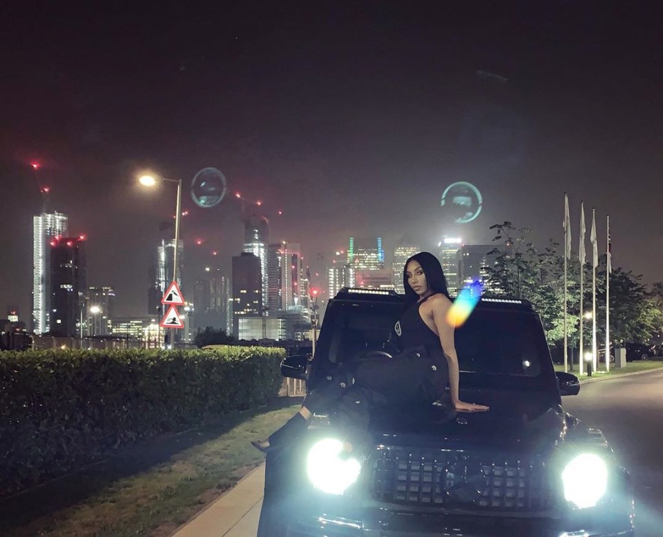  Rita Mahrez poses astride a Mercedes G Wagon - the car she was driving with her feet up