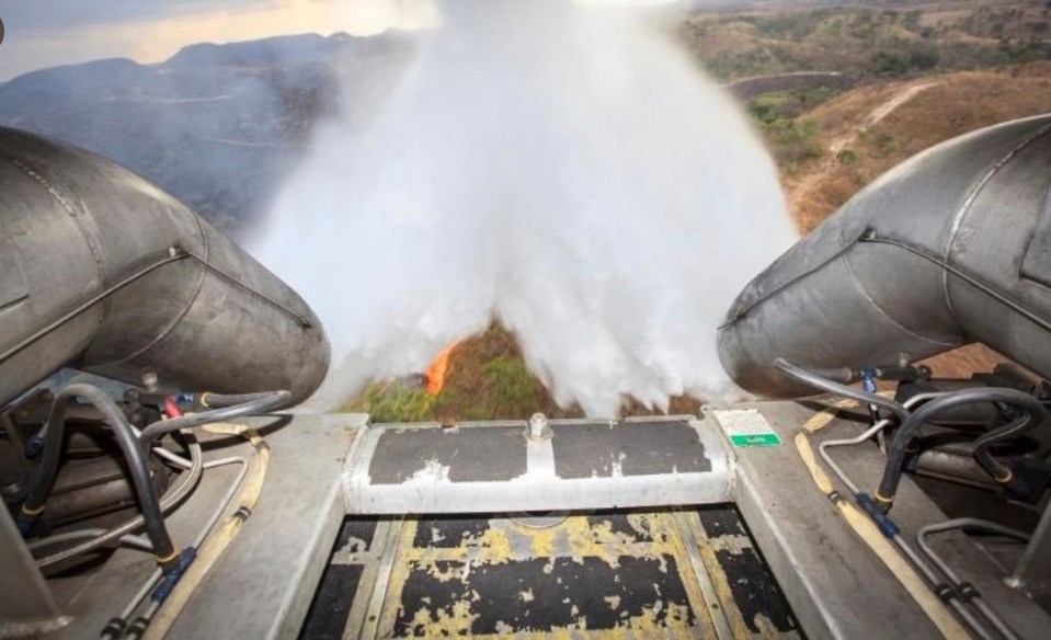  A video released by the defence ministry showed a military plane raining water down onto the fires below