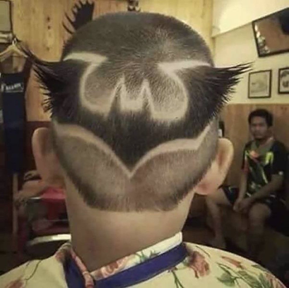  This customer may be entirely unaware that his barber has crafted a comic hero to his head