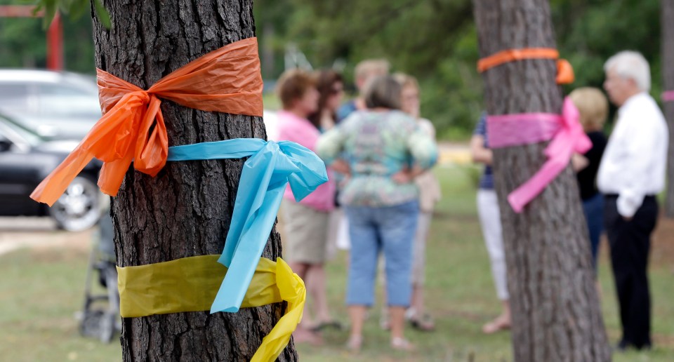  Lemm Elementary School placed ribbons on the trees in honour of the family killed in the multiple shooting