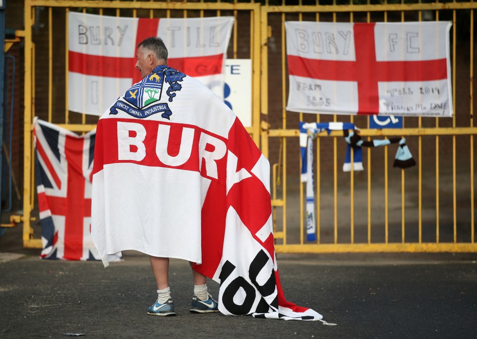  A Bury fan outside their ground Gigg Lane on the day they were expelled from the Football League