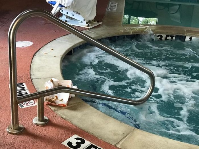  This hotel guest left the remains of their chicken dinner takeaway next to the hot tub