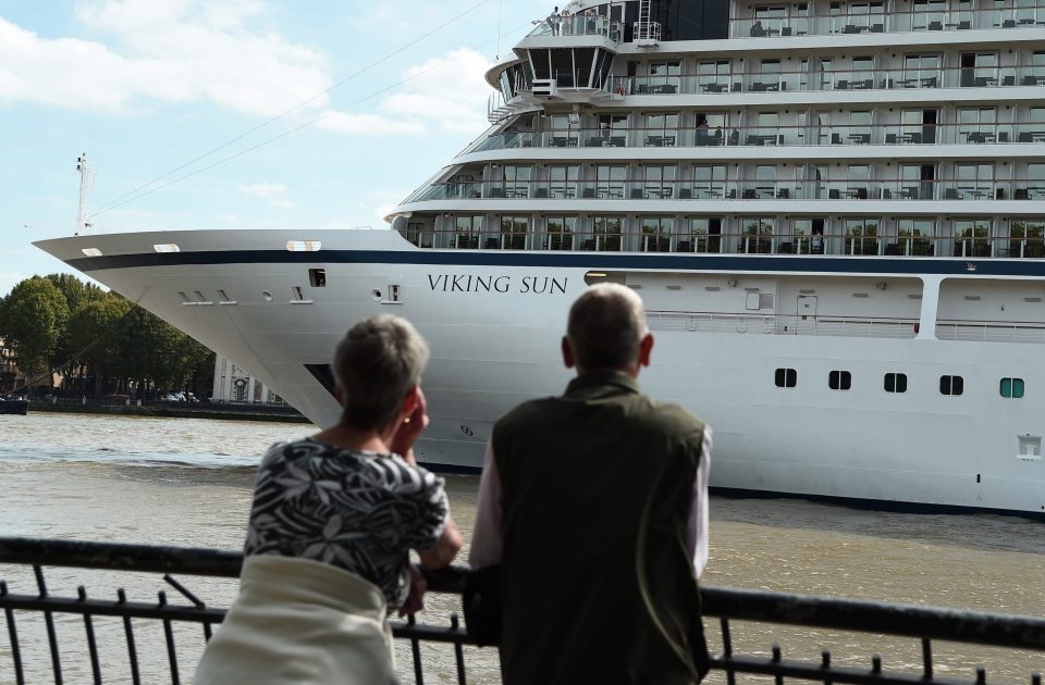  Two onlookers take in the enormity of the ship's size