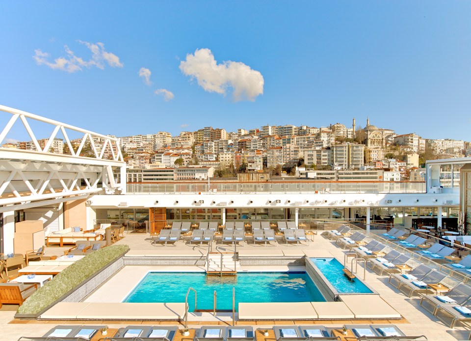  A view from one of the pools on the ships deck offers the ultimate in cruise relaxation