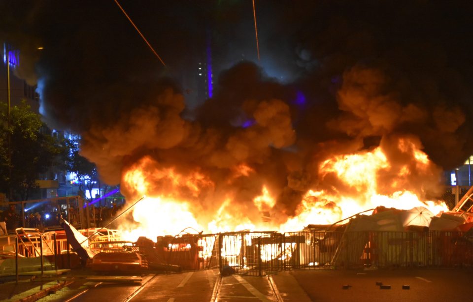  Battle for democracy... demonstrators set materials on fire near Wanchai police station