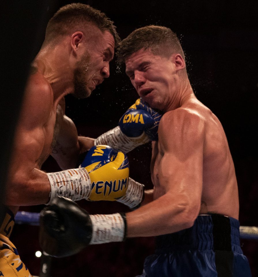  Lomachenko clobbers Campbell with a left en route to taking three of the four lightweight belts