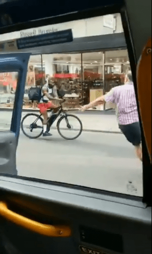  The driver leaped out of his cab and ran at the cyclist