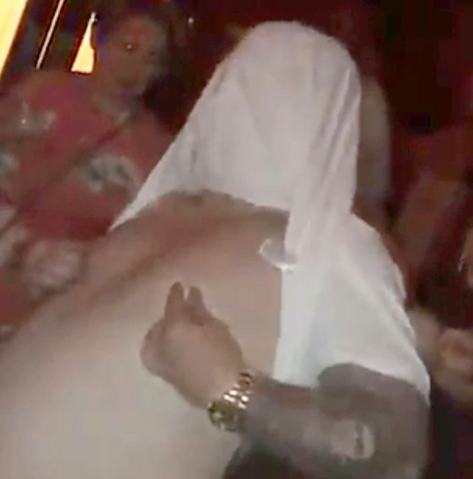  Ricky Hatton looks worse for wear as he was filmed dancing with his shift over his head in a Tenerife bar