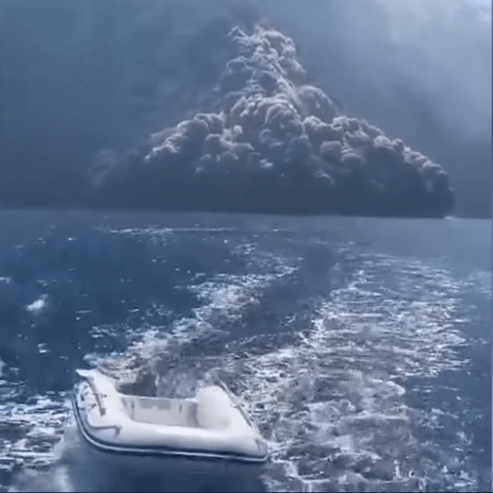  A panicked sailing crew shout to each other to leave the area as they are followed by the huge volcanic cloud