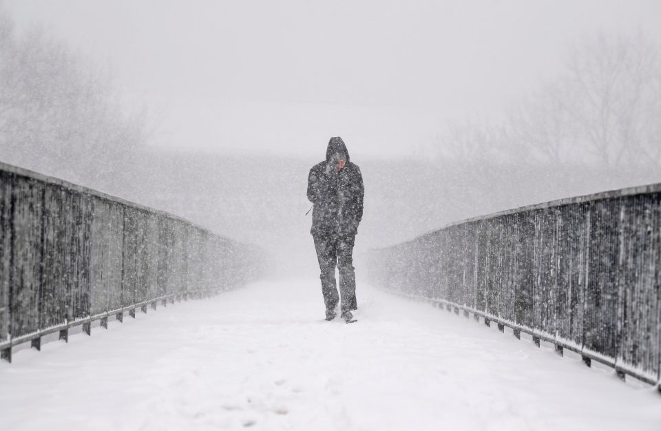  A man in Glasgow makes his way through the snow as sub-zero temperatures hit Britain last winter