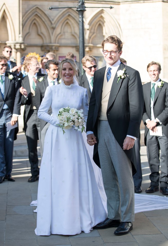 Ellie pictured with art dealer husband Caspar Jopling at York Minster in a gothic style white gown