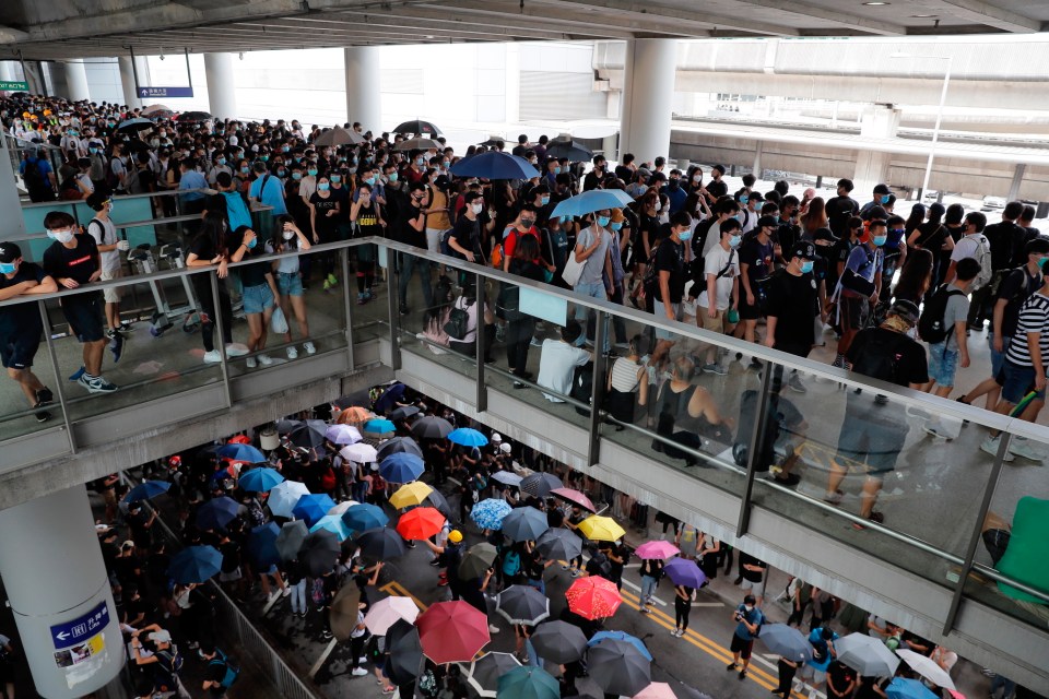  Pro-democracy protesters gather outside the airport in Hong Kong, Sunday, September 1