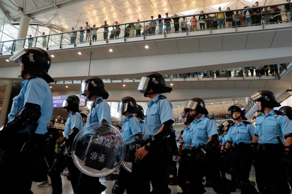  Police officers take position outside the international airport