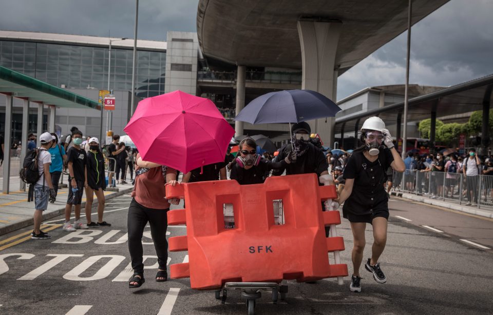  Thousands of protesters blocked roads and public transport links to Hong Kong airport