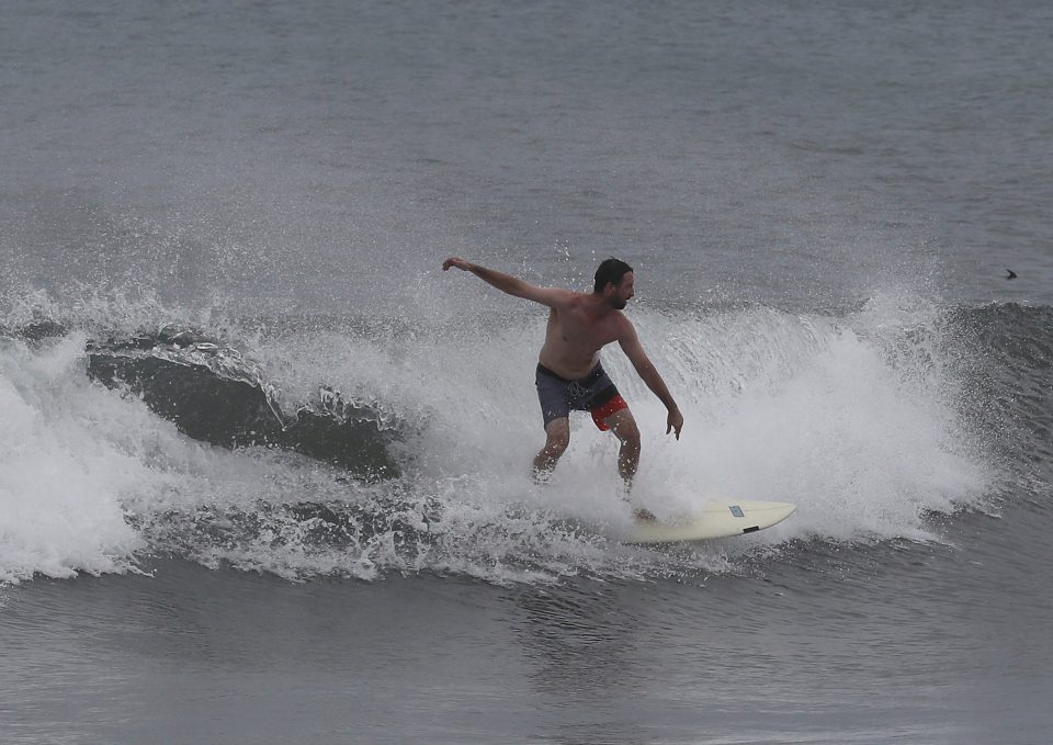  A surfer enjoys the waves in Boca Raton, Florida, as Hurricane Dorian approaches