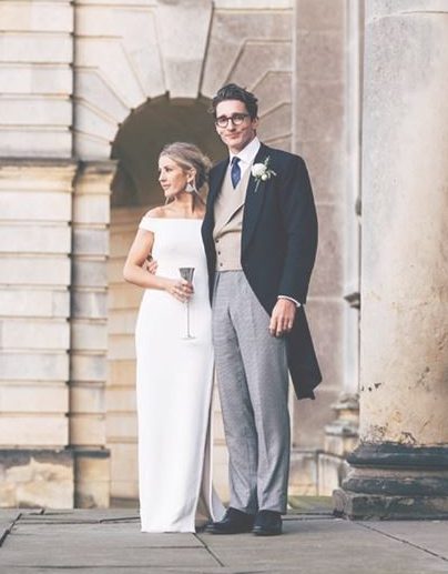 She changed into an off-the-shoulder white dress for the evening