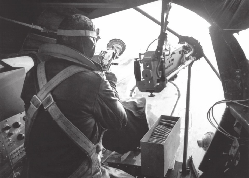  A gunner sits in the cramped nose position of a B-17