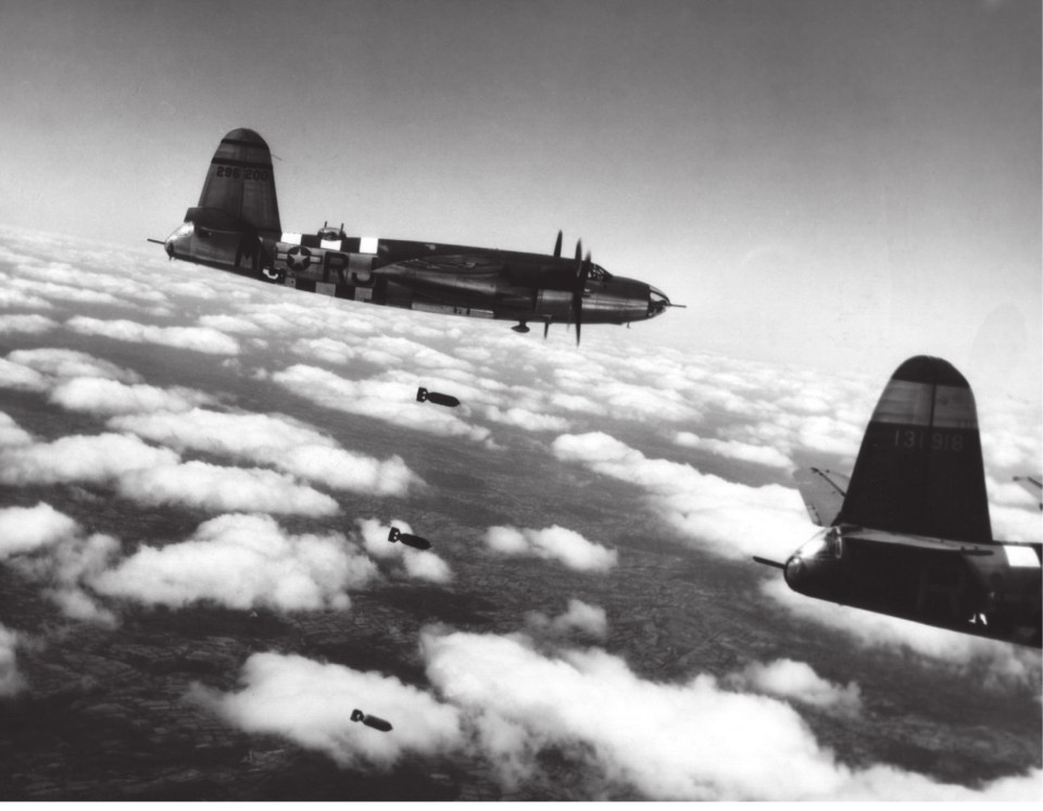  Marauders bearing the Normandy invasion stripes pounding targets in France