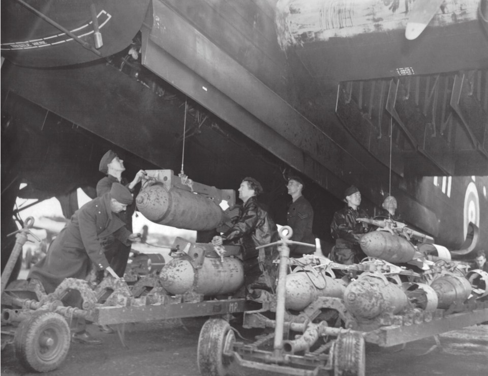  Troops loading bombs into RAF aircraft before a raid on the enemy forces