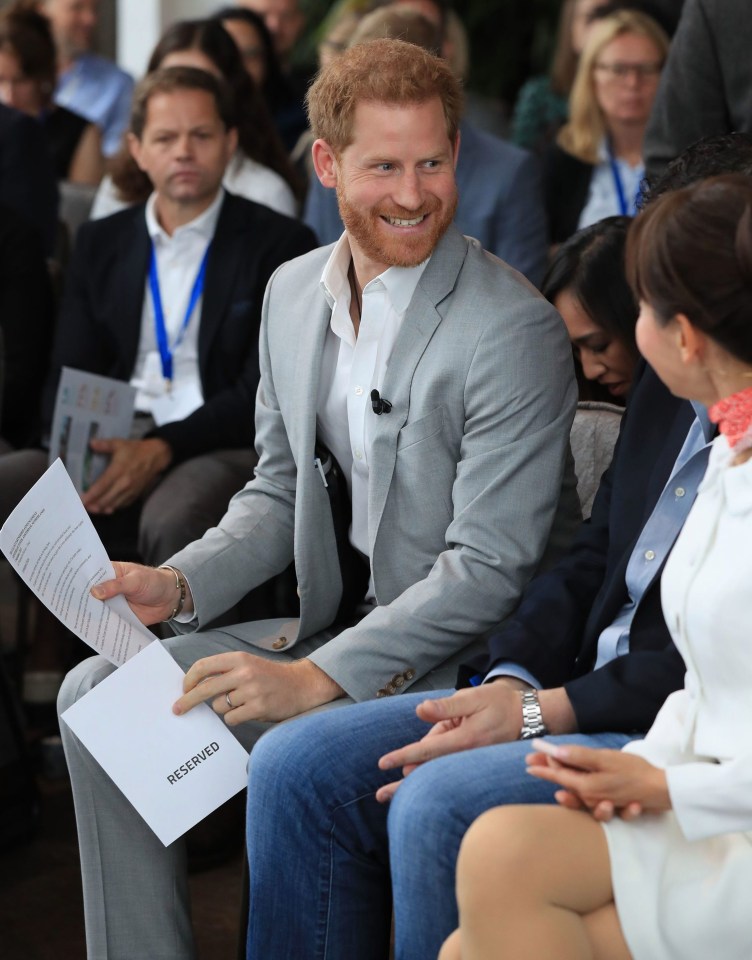 The 34-year-old grins before taking to the stage