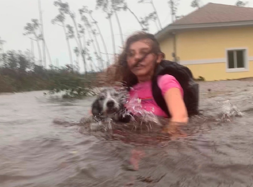  Julia Aylen and her dog are rescued from her home in Freeport, Bahamas