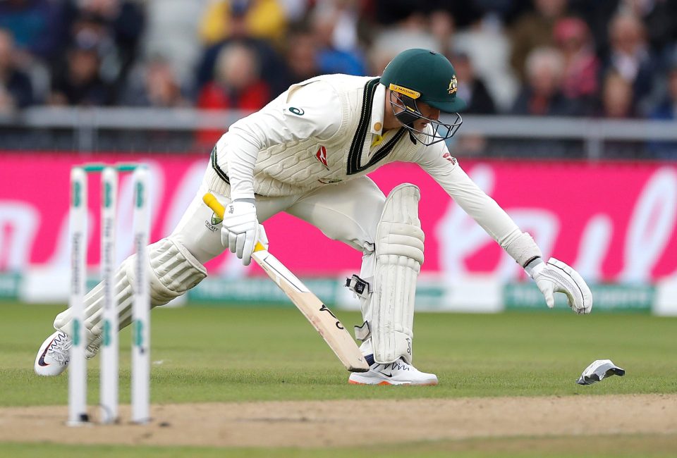  Marnus Labuschagne makes a valiant attempt to grab a free-flowing crisp packet on the pitch