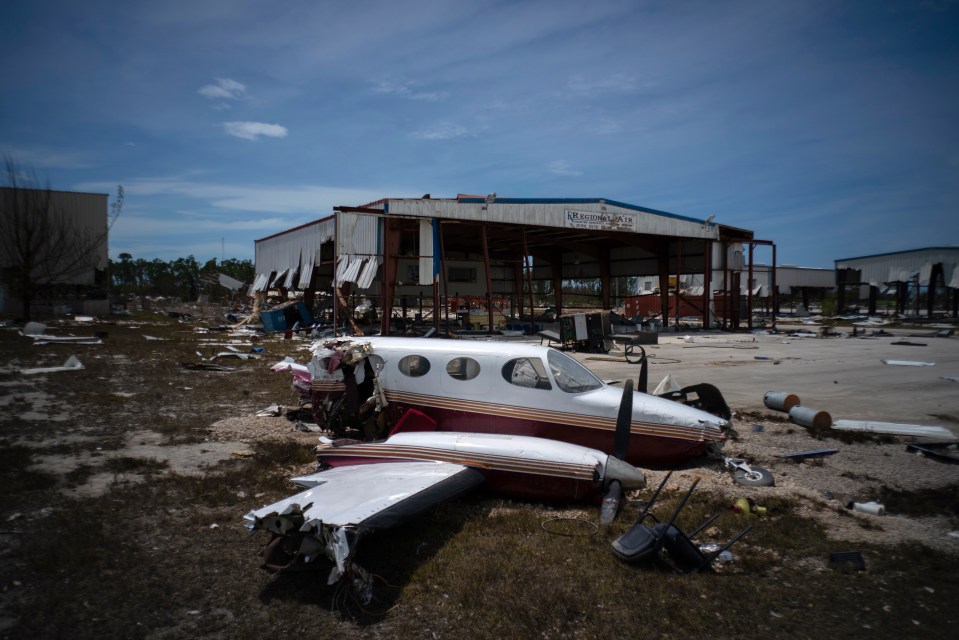  The remains of a plane strewn across an airport on the islands