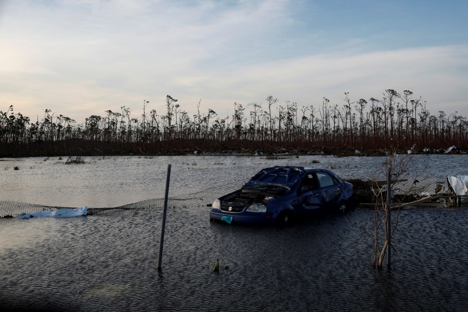  A cars in a flooded car park next to Leonard M. Thompson International Airport in the Bahamas