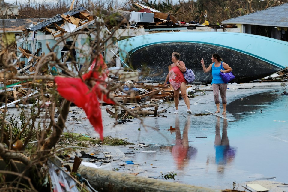  Women walk through the rubble in the aftermath of Hurricane Dorian on the Great Abaco island town of Marsh Harbour, Bahamas