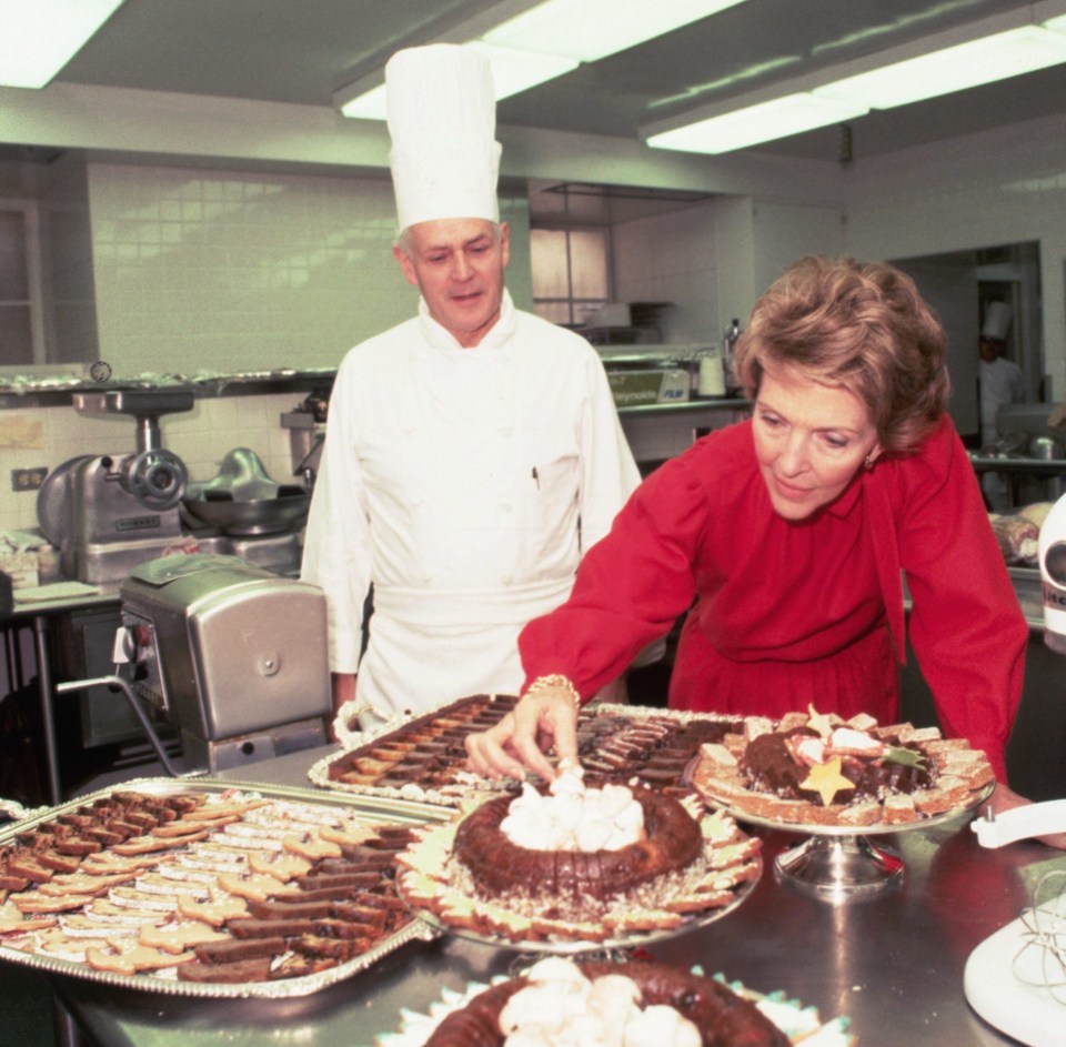 Then-first lady Nancy Reagan checks on the preparation of desserts in the Chocolate Shop