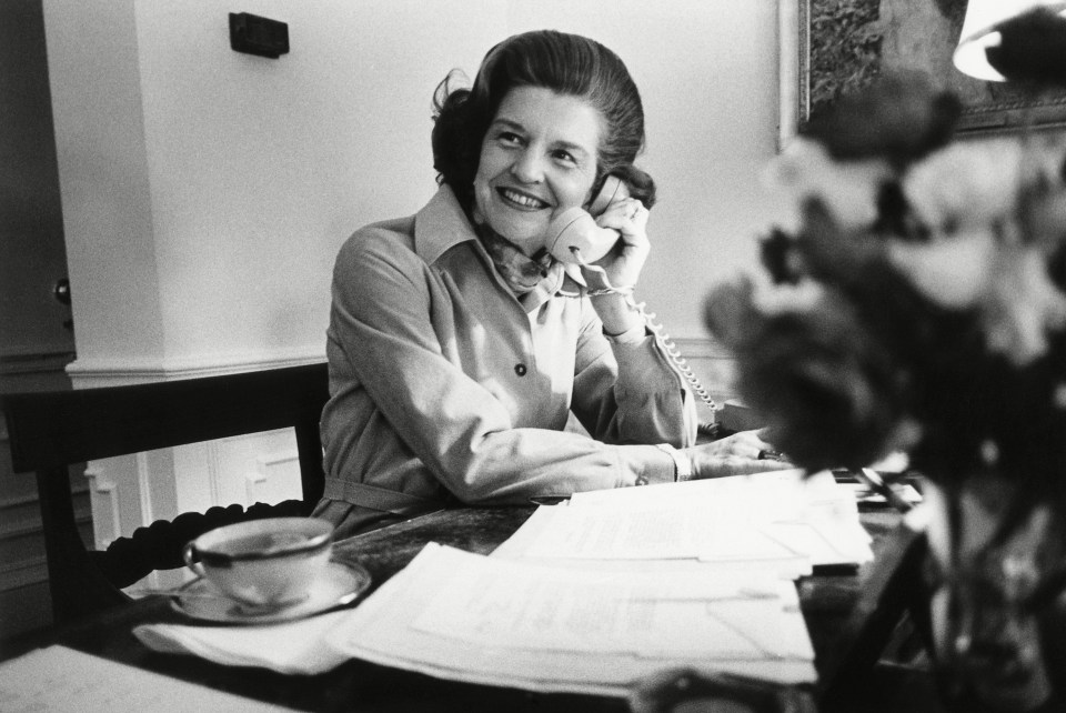 Betty Ford works at her desk inside the White House boudoir