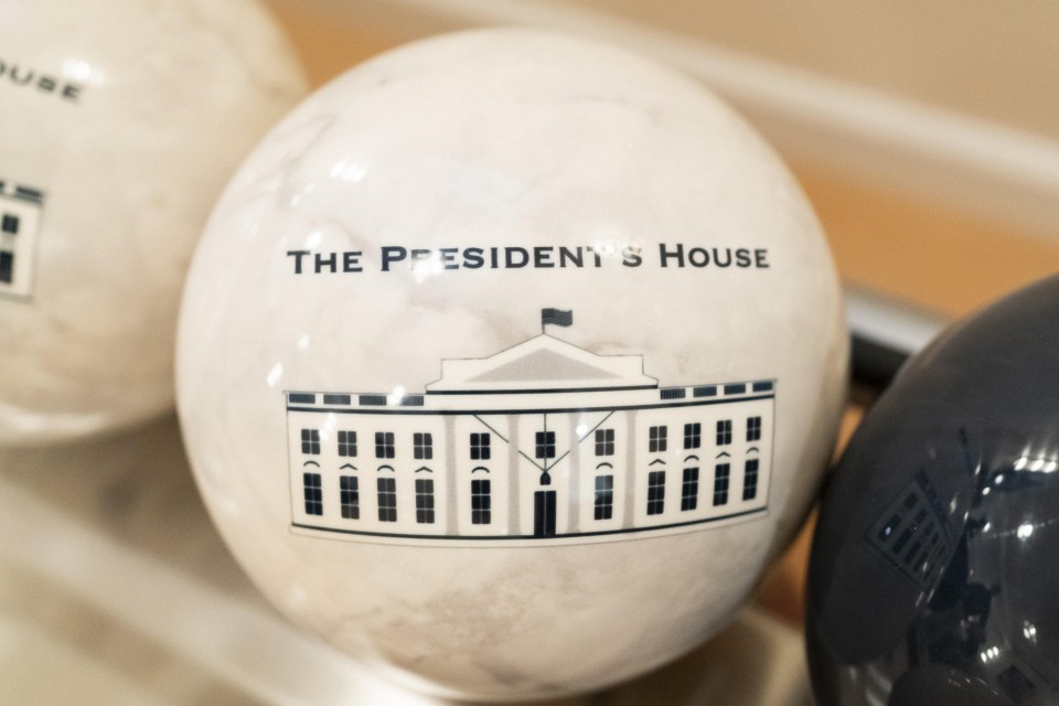 A bowling ball features an image of the White House