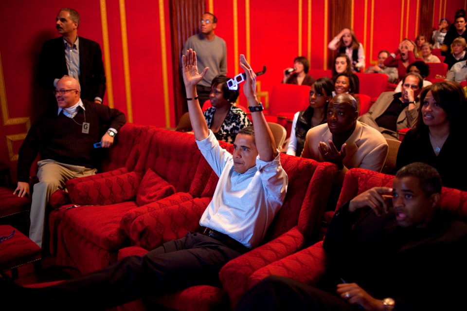 Former president Barack Obama watches the NFL’s Super Bowl XLIII game in the family theatre