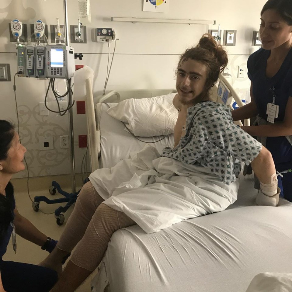  Medics help the skater do stretches in hospital as part of his recovery