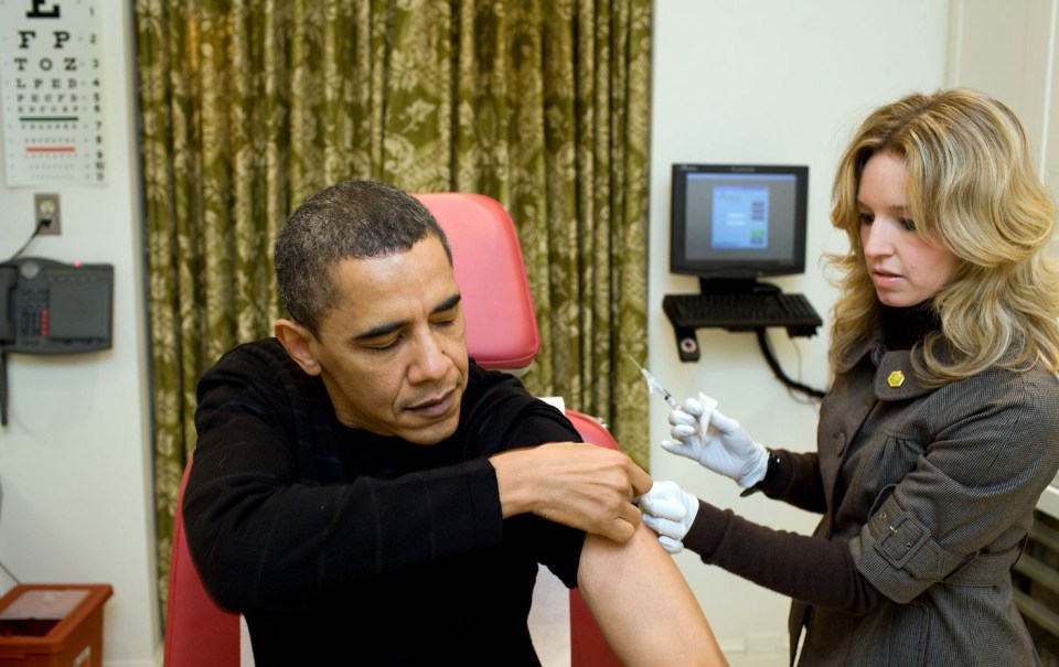 Obama receives a vaccination from a White House nurse