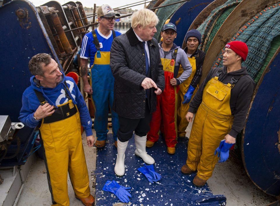  Boris meets staff at the fish market in Peterhead