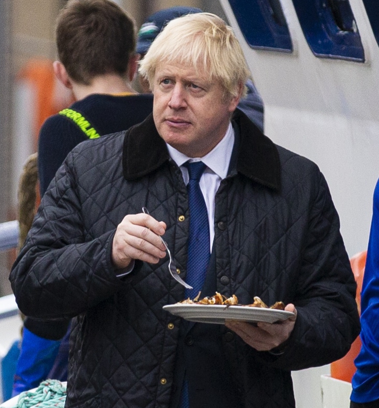  Boris tucks into some local cuisine in Peterhead