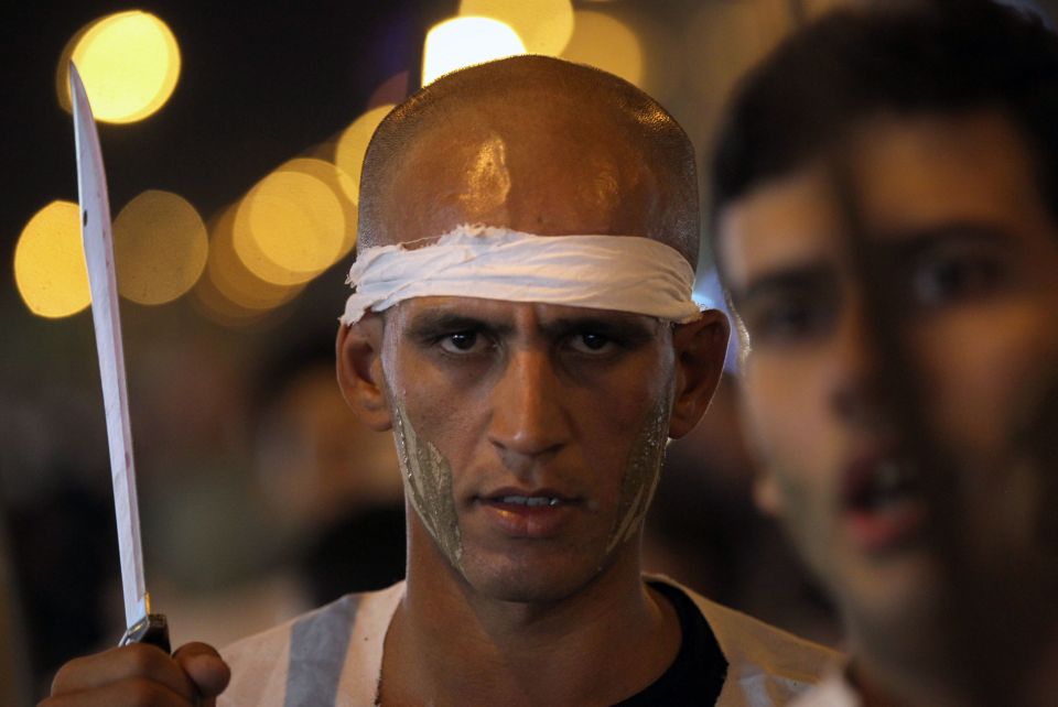  A man in Iraq prepares to take part in the bloodletting