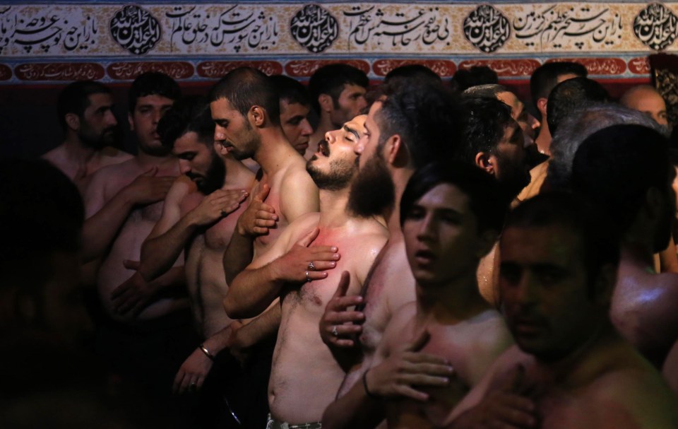  Men praying at the shrine