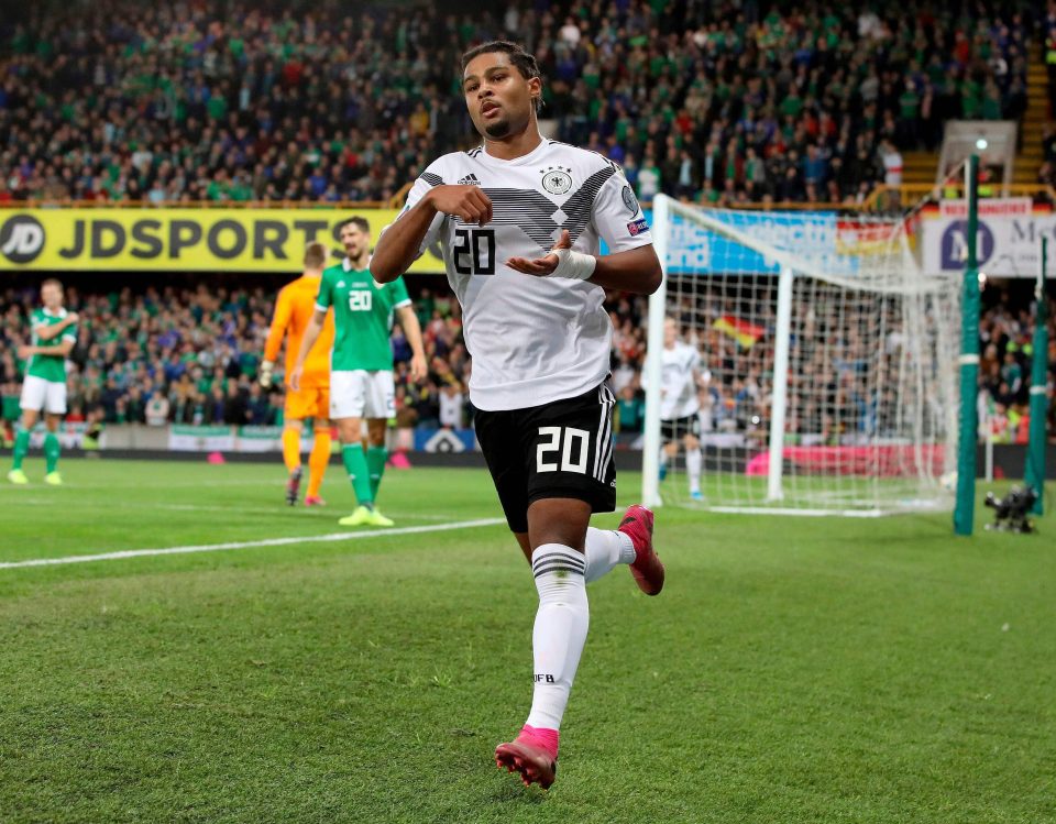  Bayern Munich winger Serge Gnabry celebrates as he seals victory for Germany from the last touch at the National Stadium in Belfast