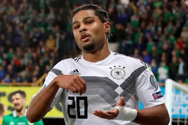 Bayern Munich winger Serge Gnabry celebrates as he seals victory for Germany from the last touch of a tight contest at the National Stadium in Belfast