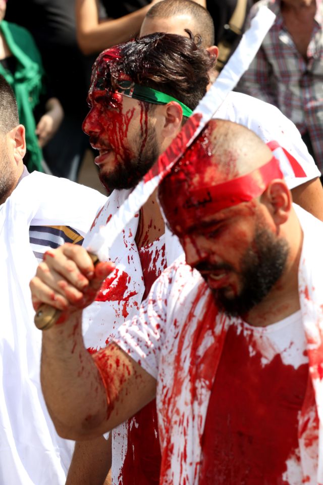  A Shia Muslim in Lebanon cuts his head with a sword as part of the Ashura commemorations