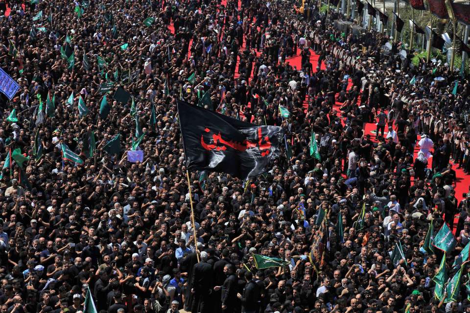  Before the stampede, Iraqi Shi'ite Muslims take part in a mourning procession on the tenth day of the lunar month of Muharram in the holy city of Karbala, September 10