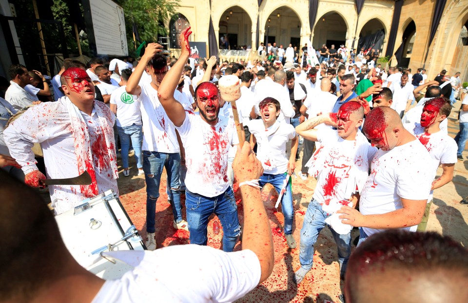  A group of man in Lebanon chant during a religious procession