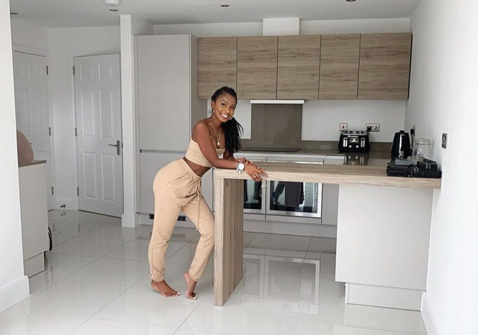  Jourdan poses in the couple's sleek new kitchen