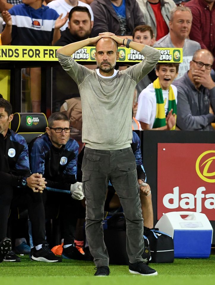  Pep Guardiola looks on in bemusement as his Man City side lose for the first time in nine months