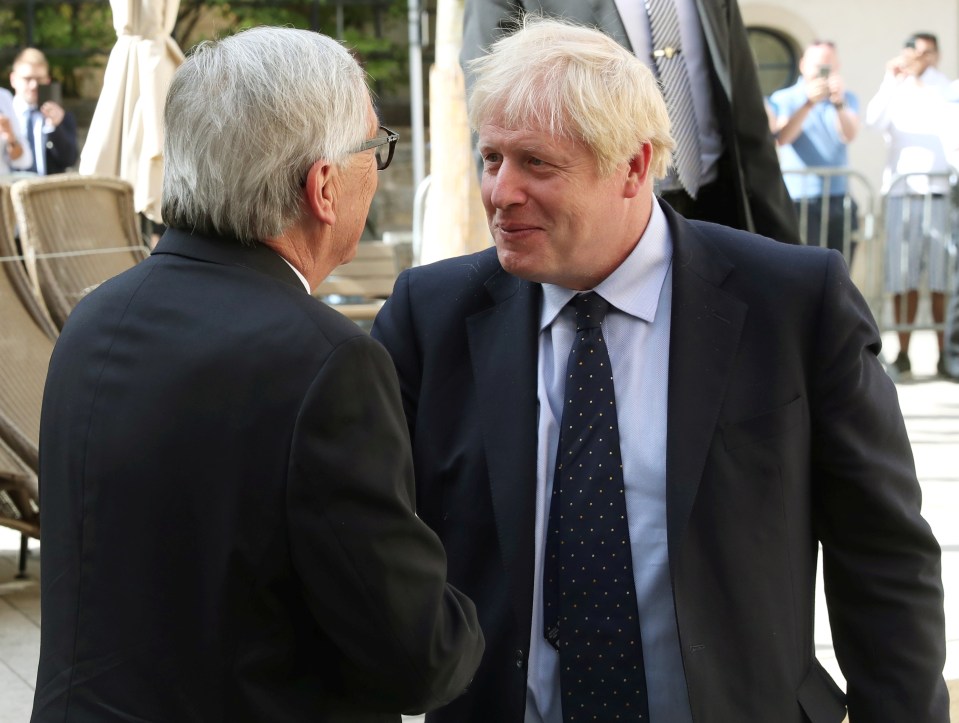  Boris shakes hands with Juncker outside Le Bouquet Garni in Luxembourg